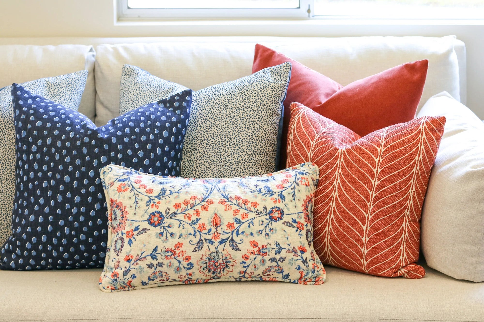 Flora Bella Throw Pillow Collection styled on sofa